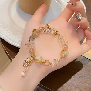 Exquisite detail shot of the Chinese style Pixiu and rutilated quartz crystal bracelet.