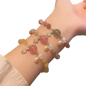Sweet fairy style natural crystal strawberry quartz and bear charm elastic bracelet.