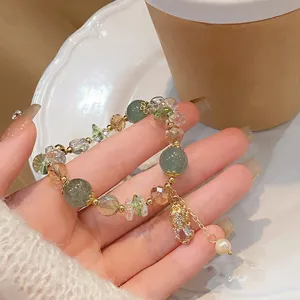 Exquisite crystal beaded bracelet featuring lucky pixiu charm, elegant hand jewelry detail shot.
