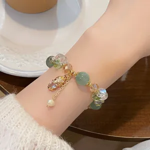 Exquisite green crystal Pixiu bracelet with pearl charm, new Chinese style detail.