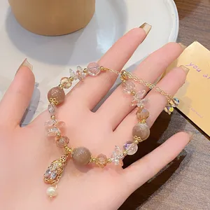 Detailed view of the Chinese style Pixiu and sunstone crystal bracelet with adjustable chain.