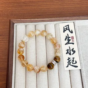 Bracelet de perles en citrine naturelle et œil de tigre avec breloques micro-serties.