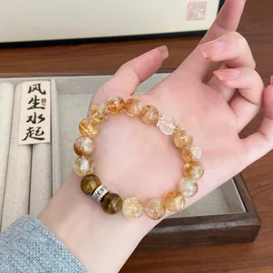 Bracelet en perles de pierres précieuses de citrine et œil-de-tigre avec charme zircon.