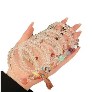 Bracelets de perles de cristal blanc transparent empilables avec breloques et pompons chinois.