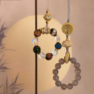 Palace style multi-treasure glass and grey agate lotus phone charm keychain accessory detail.
