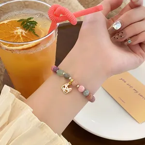 Sweet macaron colored jade beaded bracelet with cute fox mask charm, Chinese style detail view.
