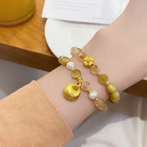 Chinese style citrine and tiger eye stone beaded bracelet set with gold charm details