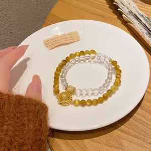 Detail shot of the new Chinese style yellow crystal and golden tiger eye double layer bracelet.