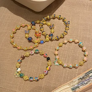 Bracelet de perles papillon cloisonne ethnique retro, detail en cuivre dore exquis.