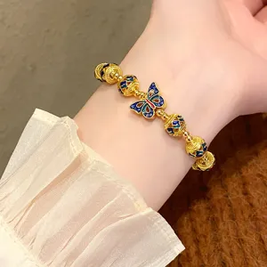 Bracelet de perles papillon en émail rétro, bijoux de mode plaqués or de style ethnique.