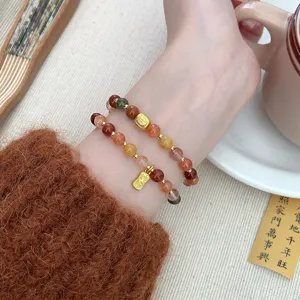 Chic double-layer crystal stone bracelet with gold charms and sweet Chinese style design.