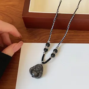Collier pendentif Bouddha en obsidienne noire avec cordon tressé et accents argent.