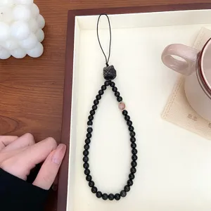 Chaîne de téléphone en perles noires de style chinois pendentif sac avec perles sculptées.