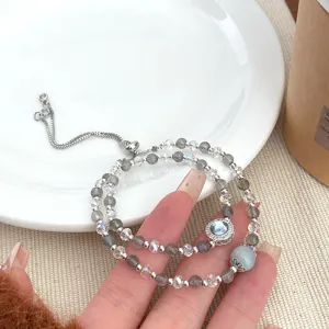 Elegant double layer crystal bracelet with grey moonstone and adjustable silver chain for women.