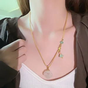 Close-up detail view of the new Chinese style natural white agate ruyi pendant necklace with beads.