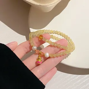 Natural yellow crystal double-layer beaded bracelet with pearl and golden gourd pendant.