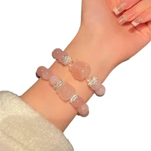 Sweet pink crystal bracelet set with cute cartoon bear charm and sparkling rhinestones for women.