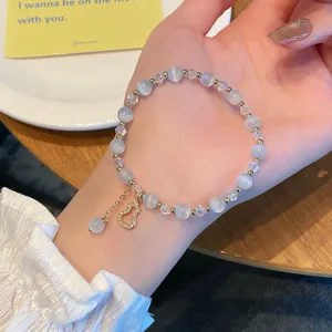 Bracelet de perles en pierre d'œil de chat et cristal avec pendentif gourde pour femmes.