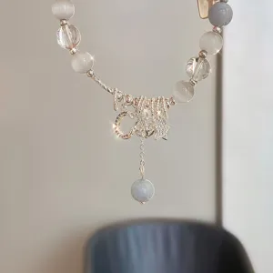Exquisite Chinese-style retro blue cat eye stone bracelet with moon and star pendants for women.