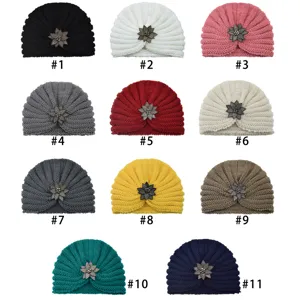 Women winter warm knitted turban hat with crystal flower brooch multi color variant display.