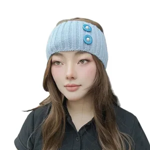 Light blue knitted headband with pearl button detail, cozy ribbed hair accessory for daily wear.