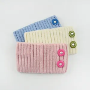 Knitted ribbed headband with pearl buttons, soft winter ear warmer and hair accessory.
