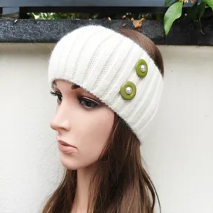 Detailed side view of a white knitted headband featuring stylish green pearl buttons for daily wear.