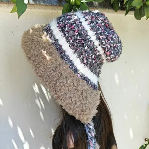 Cozy plush knit beanie hat with furry brim and tassel braids for warm winter fashion and daily wear.