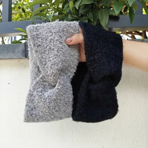 Plush twist headband detail, soft knitted winter hair accessory in grey and black colors.