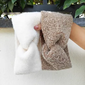 Close-up detail of soft plush cross headbands, warm knitted hair bands for daily facial wash.