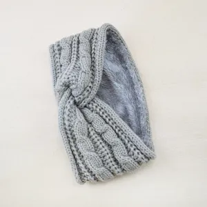 Detailed view of a cozy grey knitted twist fleece headband showing the plush lining texture.