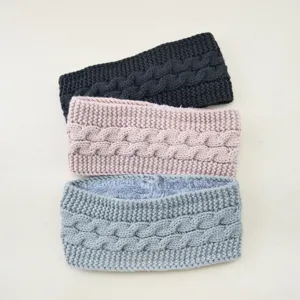 Detailed view of cozy knit cable headbands with soft fleece lining, winter warm hair accessories.