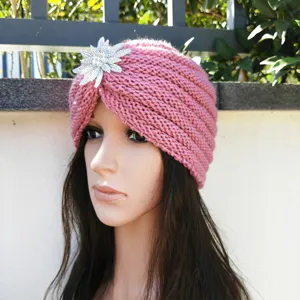 Pink knitted turban hat for women, autumn winter warm beanie with rhinestone flower brooch accessory.