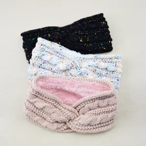 Detailed view of winter knitted fleece-lined cross headbands in multiple colors for warmth.