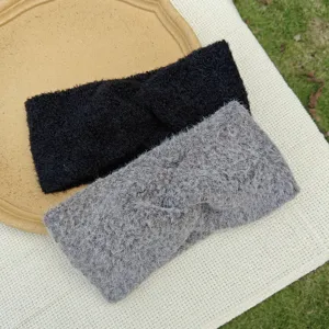 Plush twist headband detail shot, soft knitted fuzzy winter hair band in black and grey.