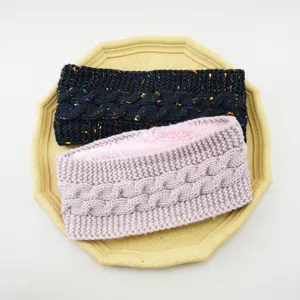 Detailed view of cozy fleece lined cable knit headband, warm winter hair accessories.