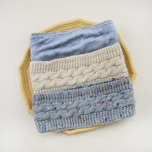 Cozy fleece-lined cable knit headband detail, soft winter warm hair accessory close-up.