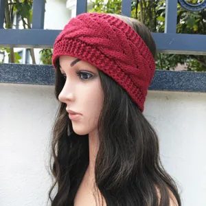 Detailed view of the red cable knit headband showing the cozy texture and stylish winter design.