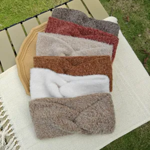 Detailed view of fluffy knitted twisted headbands in various solid colors for daily wear.