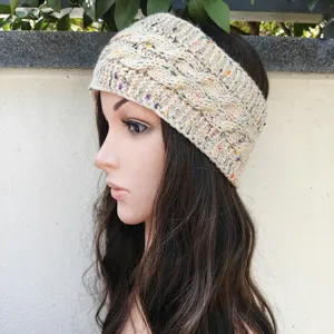 Fleece lined cable knit headband with colorful flecks, winter warm hair accessory detail.