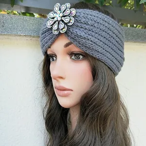 Grey knitted headband with dazzling rhinestone flower, warm autumn winter hair accessory.
