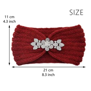Close-up detail of the red knitted headband with rhinestone flower brooch and cozy texture.