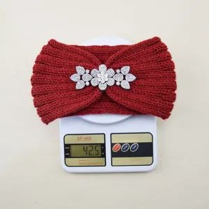 Red knit headband detail, winter warm hair accessory with sparkling rhinestone flower decor.