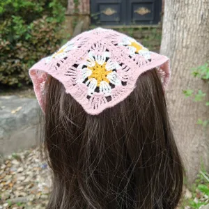 Detailed view of the cute floral crochet hair bandana, vintage pastoral style spring head wrap.
