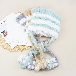 Fluffy striped knit hat for women, cute winter warm beanie with long earflap strings and pompom.