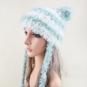 Detail view of the cozy winter striped furry hat with cute pom-pom and long braided earflaps.