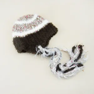 Cozy knit winter beanie hat with braided tassel string, soft plush warm casual detail.