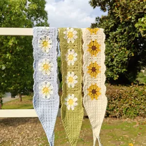 Handmade crochet floral headband detail shot, daisy sunflower knit hair scarf for pastoral style.