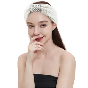 Close-up detail of a cozy knitted headband featuring elegant sequin accents and knotted style.