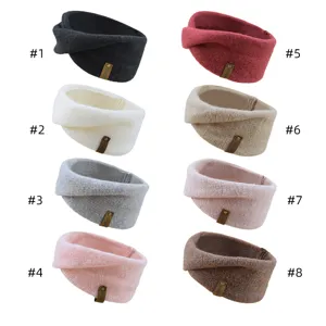 Close-up details of assorted knitted twist headbands in multiple colors with cute leather tags.